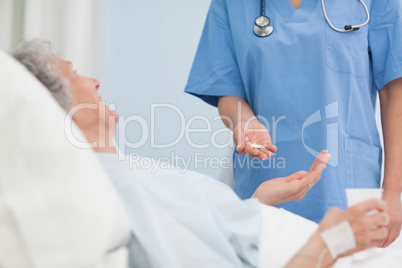 Nurse holding drugs in her hand
