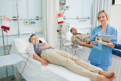 Transfused patients next to a nurse