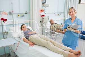 Transfused patients next to a nurse