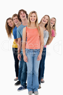 A full length shot of six people looking forward at various angl