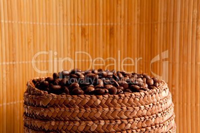 Top of a basket full of roasted coffee seeds