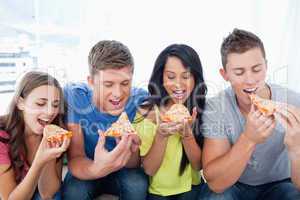 Friends eating pizza together