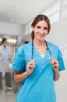 Nurse holding a stethoscope around her neck