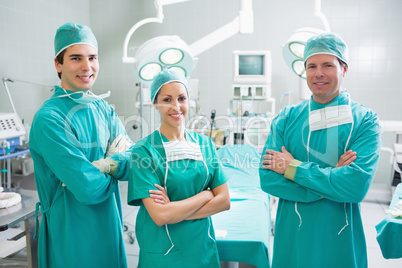 Surgeons standing up with arms crossed