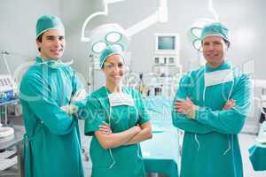 Surgeons standing up with arms crossed