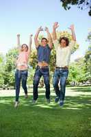 Three students jumping