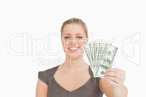 Woman showing dollars banknotes