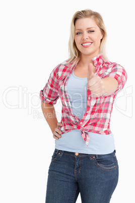 Cheerful blonde woman wearing a plaid shirt