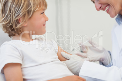 Doctor giving to a child an injection