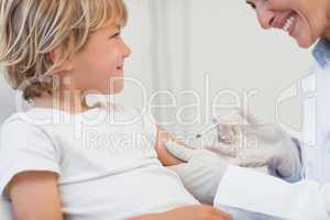 Doctor giving to a child an injection