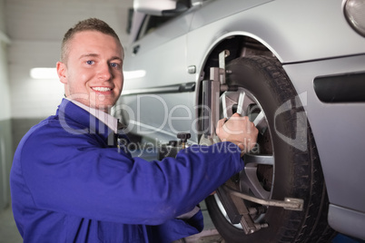 Mechanic repairing a car wheel