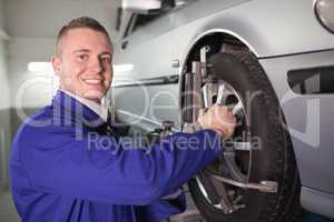 Mechanic repairing a car wheel