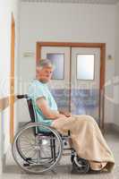 Patient sitting in a wheelchair with a blanket