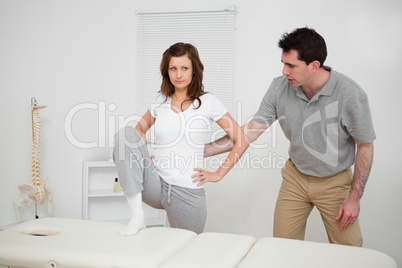 Brunette woman doing stretching exercises