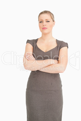 Serious woman standing with arms crossed