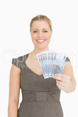 Woman showing her euro banknotes