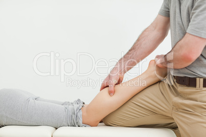 Close-up of a woman lying while being massaged