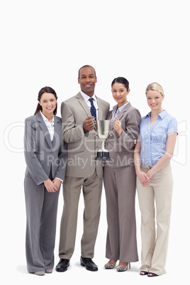 Business team holding a cup