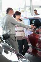 Woman looking at a car interior