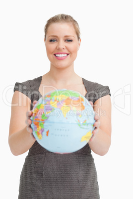 Woman showing a globe
