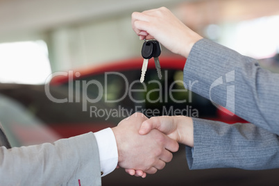 Close up of a woman shaking hand to a man