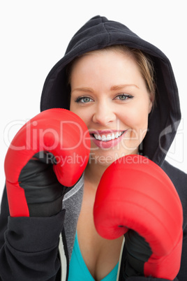Pretty smiling woman boxing