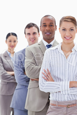 Close-up of colleagues smiling in a single line crossing their a