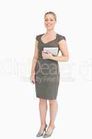 Woman standing while holding an ebook