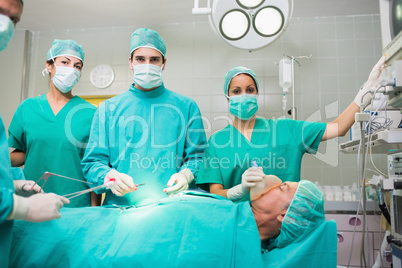 Surgical team looking at camera