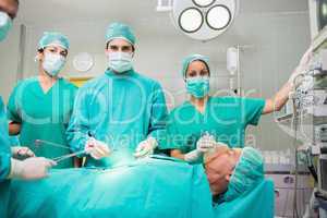 Surgical team looking at camera
