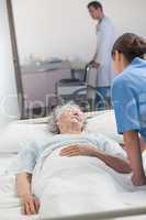 Nurse looking after an elderly patient