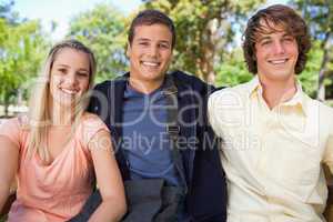 Portrait of three smiling students