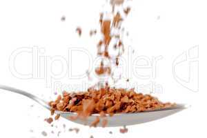 Chocolate powder falling in a spoon