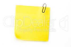 Sticky note with grey paperclip