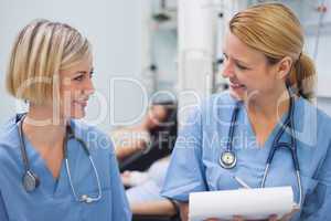 Smiling nurses talking