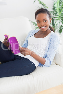Black woman holding a book