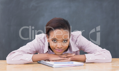 Black woman leaning her head on desk