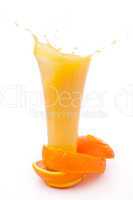 orange peel surrounded around a overflowing glass