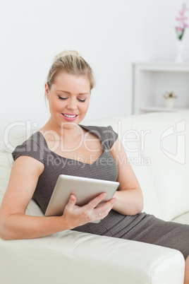 Woman touching screen of ebook