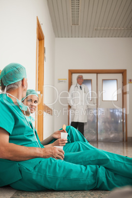 Surgeons talking next to a doctor