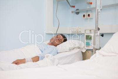 Asleep patient on a medical bed