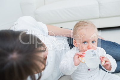 Baby drinking a bottle of water