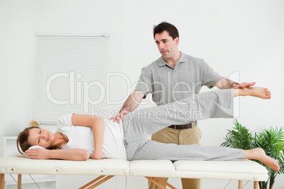 Physical therapist checking the pelvis of a woman