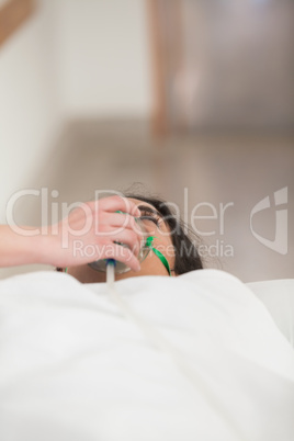 Female patient with oxygen mask
