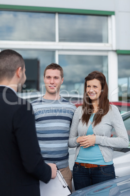 Clients talking with a dealer