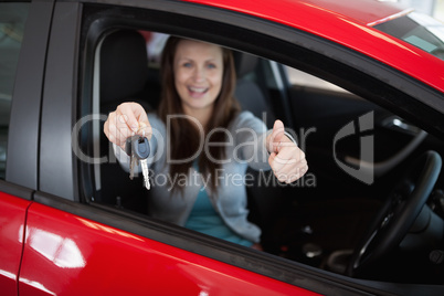 Woman holding car keys