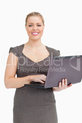 Woman holding a laptop