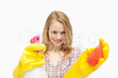 Woman holding cleaning products