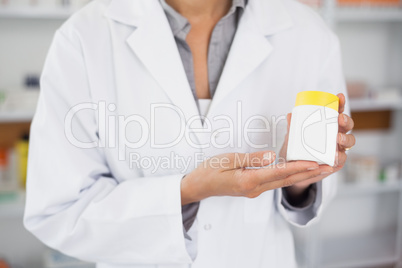 Close up of a pharmacist presenting a drug box