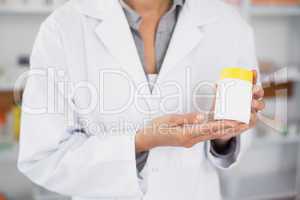 Close up of a pharmacist presenting a drug box